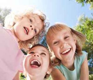 three smiling children